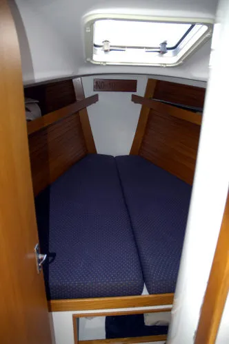 Slide: The Image of Interior of 1998 J Boats J/32 sailboat featuring cozy sleeping cabin. - 32