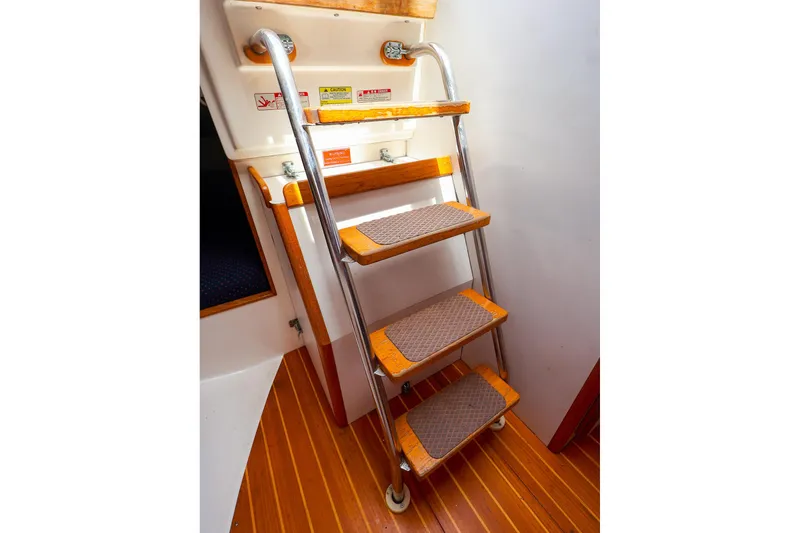 Slide: The Image of Interior ladder of 1998 J Boats J/32 sailboat with wooden steps and metal rails. - 33