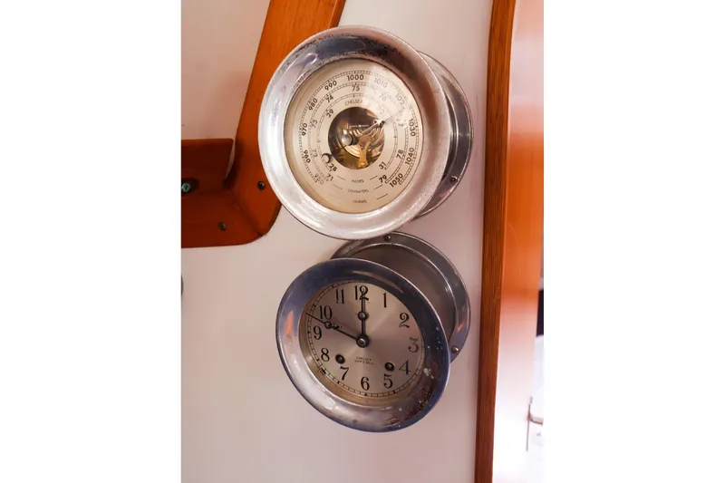 Slide: The Image of Barometer and clock on 1998 J Boats J/32 interior wooden panel. - 38