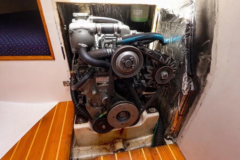 Slide: The Image of Engine compartment of a 1998 J Boats J/32 sailboat, showcasing mechanical components. - 40