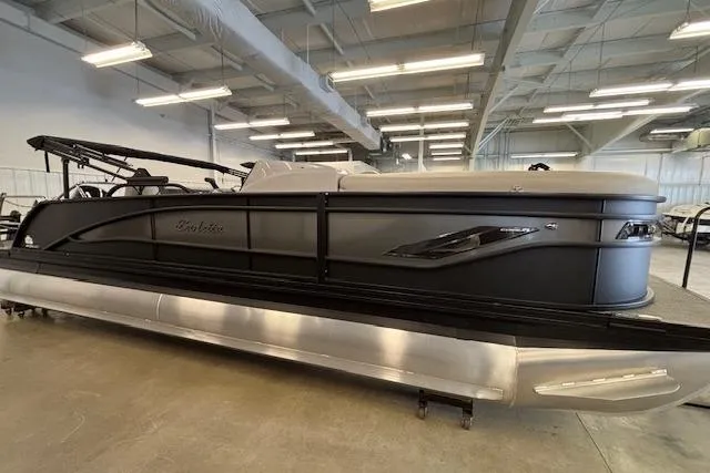 The Image of 2026 Barletta Corsa 23UC pontoon boat in showroom, showcasing sleek design and modern features. - 1