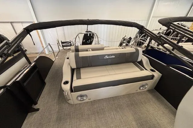 Slide: The Image of 2026 Barletta Corsa 23UC pontoon boat interior with cushioned seating and sleek design. - 15