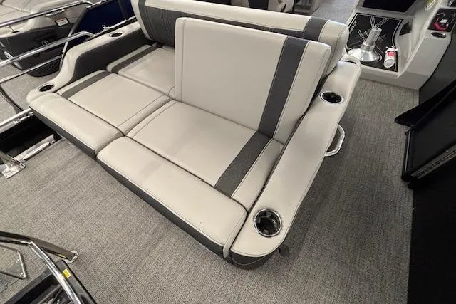 Slide: The Image of 2026 Barletta Corsa 23UC boat interior with gray seating and cup holders. - 21