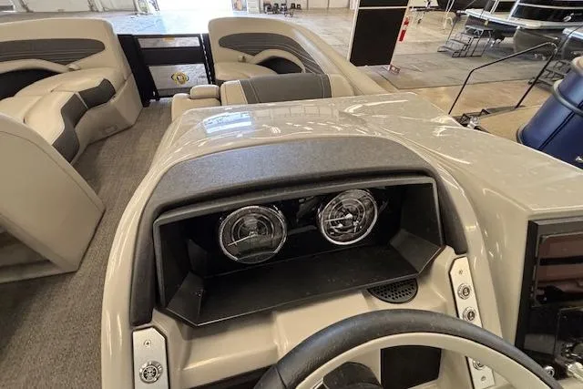 Slide: The Image of 2026 Barletta Corsa 23UC boat interior with dashboard and seating area. - 26