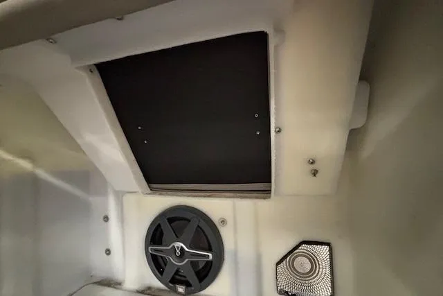 Slide: The Image of Interior view of 2026 Barletta Corsa 23UC boat, featuring speaker and storage compartment. - 28