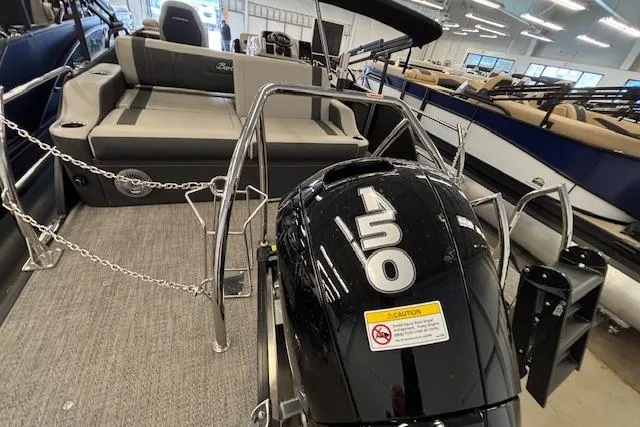 Slide: The Image of 2026 Barletta Corsa 23UC pontoon boat with 150 horsepower engine in showroom. - 4