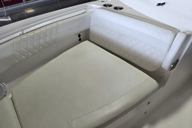 Slide: The Image of Luxurious seating on 2019 Edgewater 262CX Crossover boat with diamond-stitched upholstery. - 11
