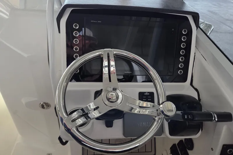 Slide: The Image of Steering console of 2019 Edgewater 262CX Crossover boat with Garmin GPS system. - 12
