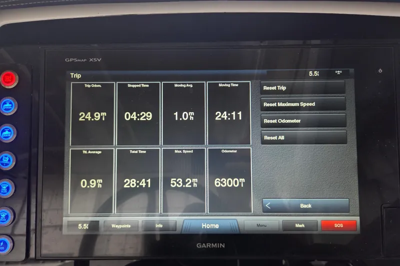 Slide: The Image of Garmin GPS display on 2019 Edgewater 262CX Crossover showing trip statistics and reset options. - 25
