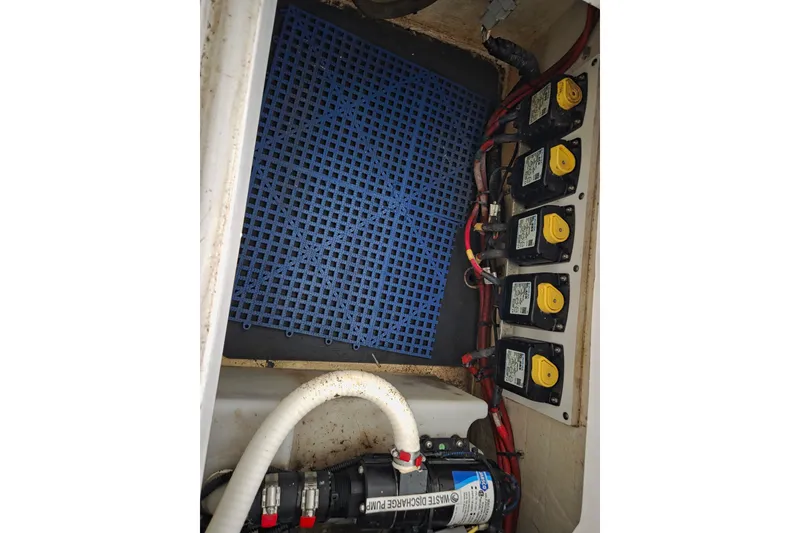Slide: The Image of Electrical panel and wiring inside a 2019 Edgewater 262CX Crossover boat. - 28