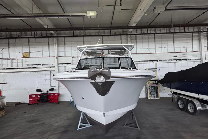 Slide: The Image of 2019 Edgewater 262CX Crossover boat in indoor storage facility. - 30