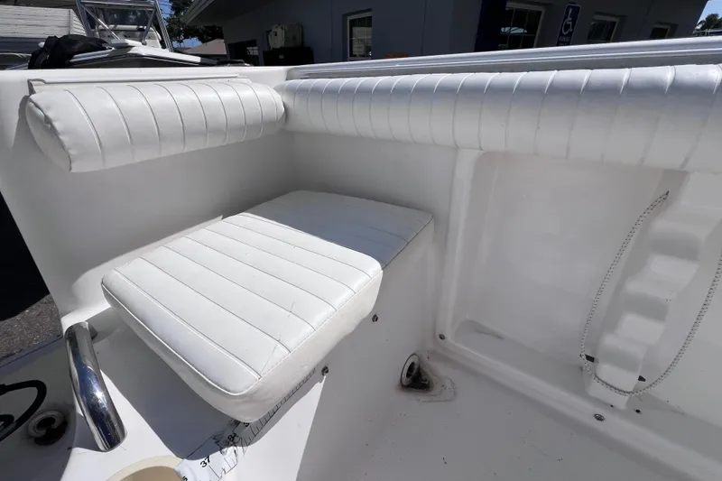 Slide: The Image of White cushioned seating on 2006 Pro-Line 23 Sport boat interior. - 12