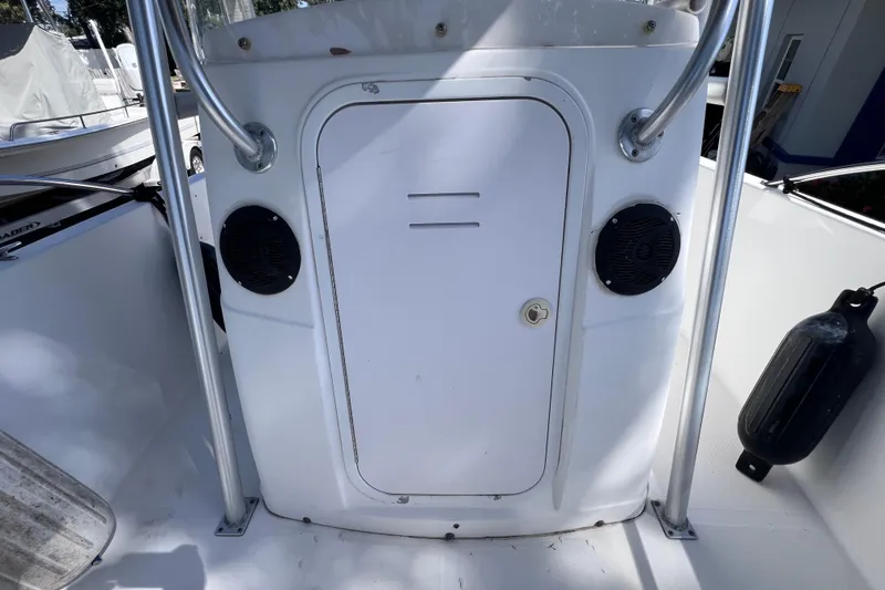 Slide: The Image of 2006 Pro-Line 23 Sport boat console with speakers and storage compartment. - 24