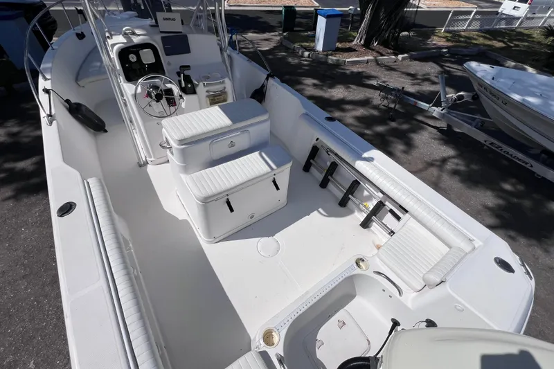 Slide: The Image of 2006 Pro-Line 23 Sport boat interior with seating and steering console. - 5