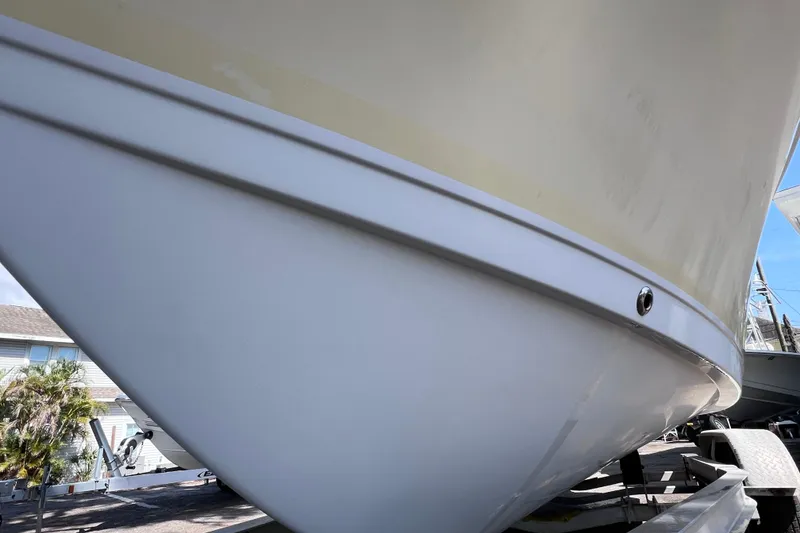 Slide: The Image of Close-up of a 2006 Pro-Line 23 Sport boat hull on a trailer. - 6
