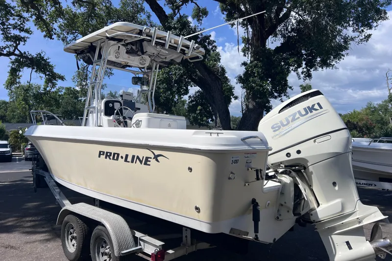 Slide: The Image of 2006 Pro-Line 23 Sport boat with Suzuki outboard motor on trailer. - 9