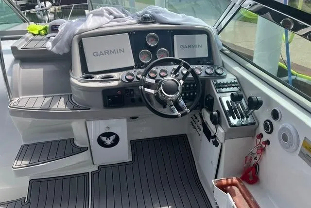 Slide: The Image of Cockpit of 2004 Formula 370 Super Sport with Garmin navigation systems and modern controls. - 10