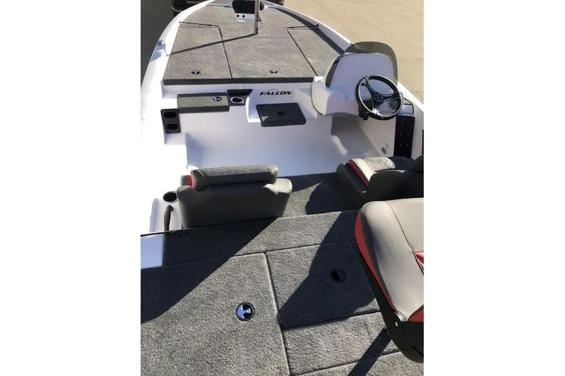 Slide: The Image of 2025 Falcon Boats 18 Freedom interior with seating and steering console. - 4