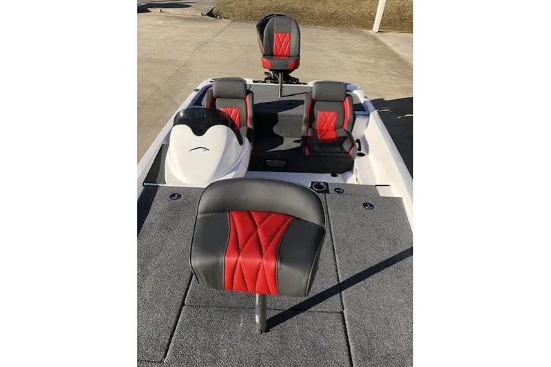 Slide: The Image of 2025 Falcon Boats 18 Freedom interior with red and gray seating on a sunny day. - 5