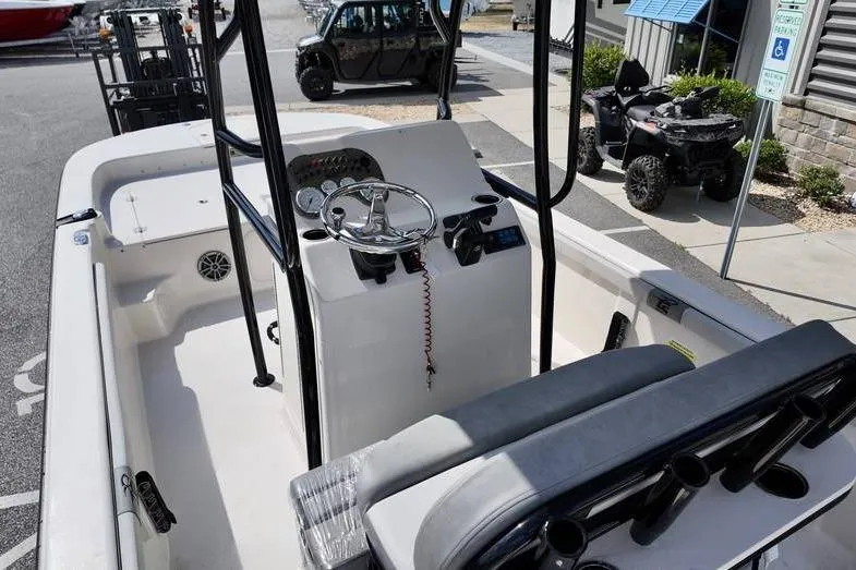 Slide: The Image of 2026 Carolina Skiff 21 LS boat interior with steering console and seating. - 6