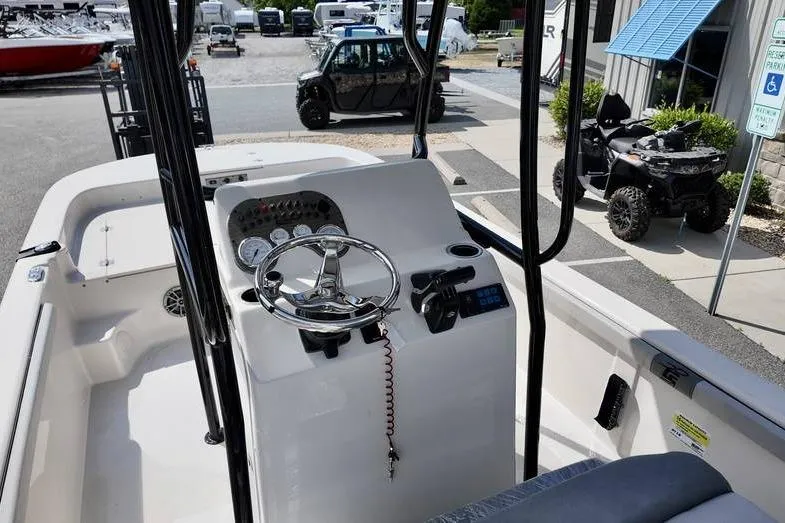 Slide: The Image of Interior view of 2026 Carolina Skiff 21 LS boat with steering console and controls. - 7