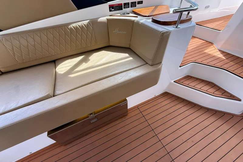 Slide: The Image of Luxurious seating on 2024 Hanover 387 boat with elegant wood flooring. - 12