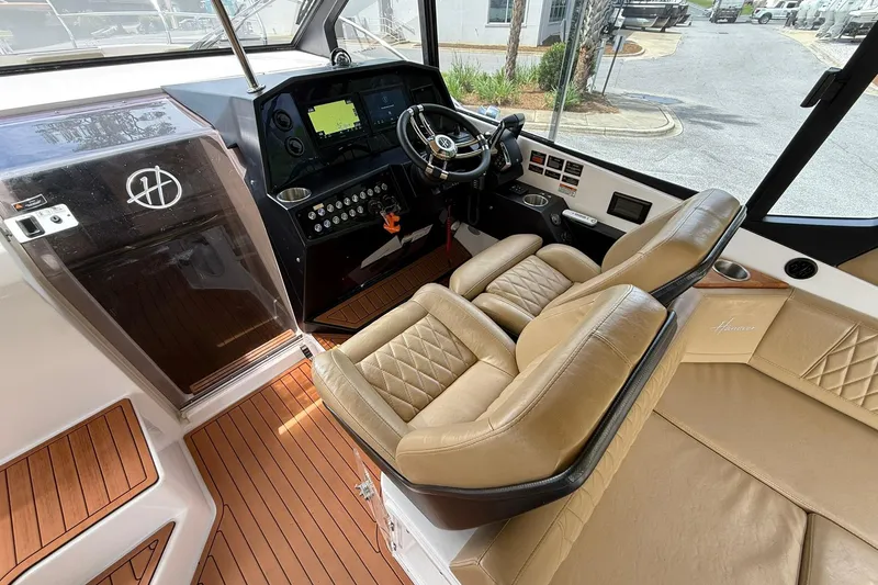 Slide: The Image of Luxurious interior of 2024 Hanover 387 boat with leather seating and modern dashboard. - 13