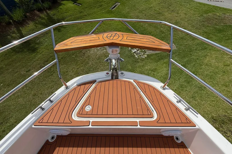 Slide: The Image of Bow view of 2024 Hanover 387 boat with teak decking and stainless steel railings. - 24