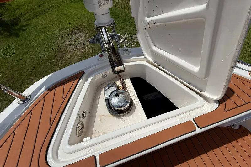 Slide: The Image of Open anchor compartment on 2024 Hanover 387 boat with teak deck. - 25