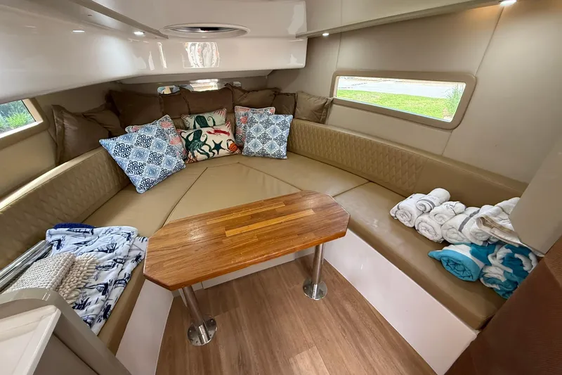 Slide: The Image of Luxurious interior of 2024 Hanover 387 boat with cozy seating and decorative pillows. - 26