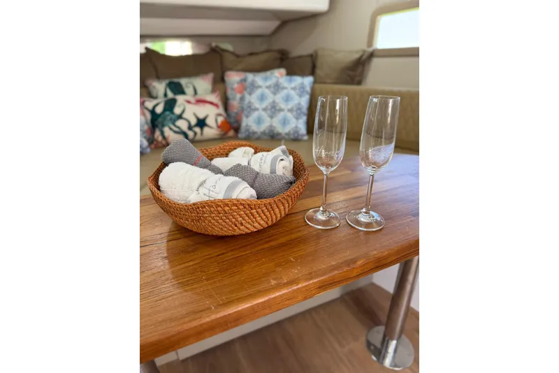 Slide: The Image of Cozy interior of 2024 Hanover 387 with basket and champagne glasses on wooden table. - 27