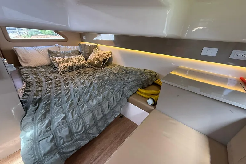 Slide: The Image of Luxurious cabin interior of 2024 Hanover 387 with cozy bedding and ambient lighting. - 30