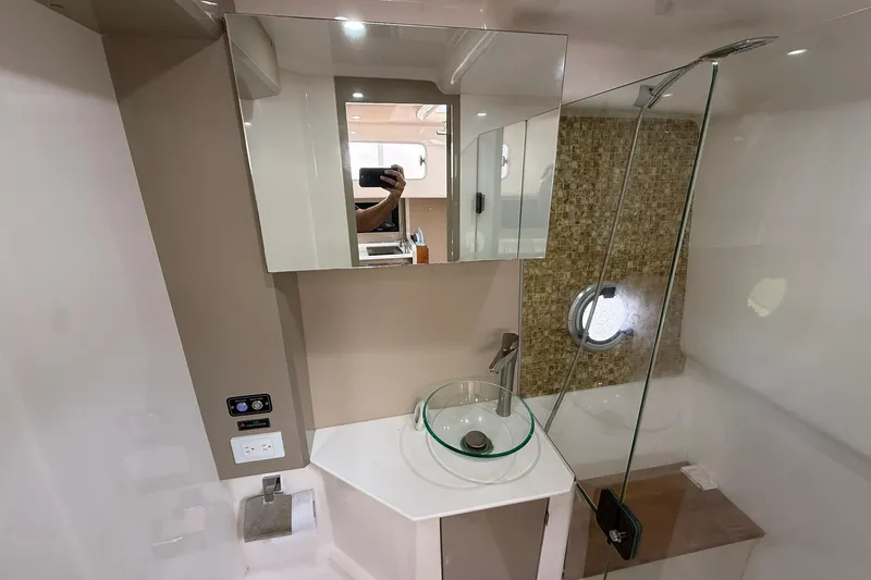 Slide: The Image of Modern bathroom in 2024 Hanover 387 yacht with glass sink and shower. - 31