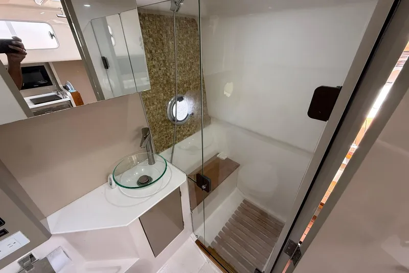 Slide: The Image of Modern bathroom in 2024 Hanover 387 yacht with glass sink and shower. - 33