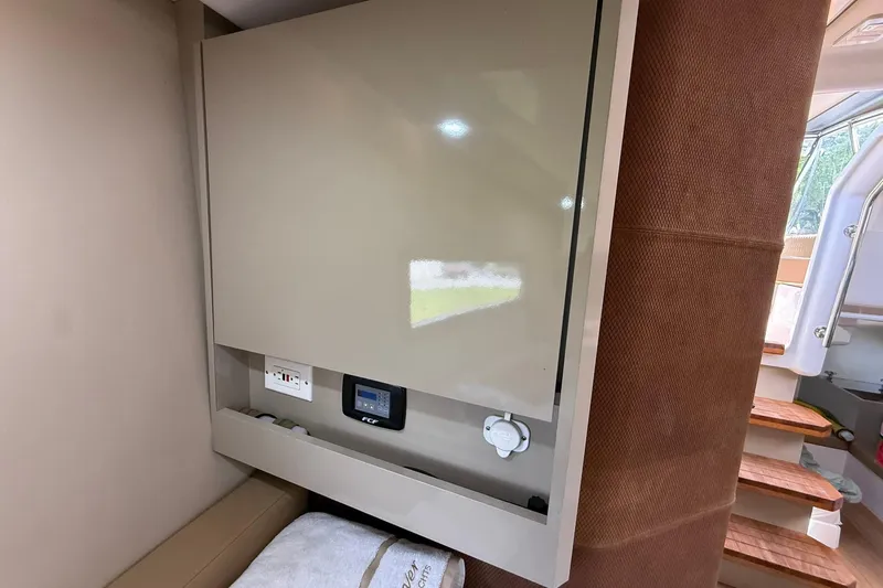 Slide: The Image of 2024 Hanover 387 interior with control panel and modern cabinetry. - 34