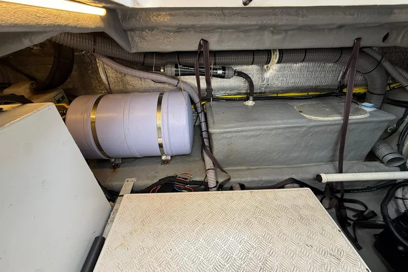 Slide: The Image of Engine compartment of 2024 Hanover 387 boat with visible components and wiring. - 38
