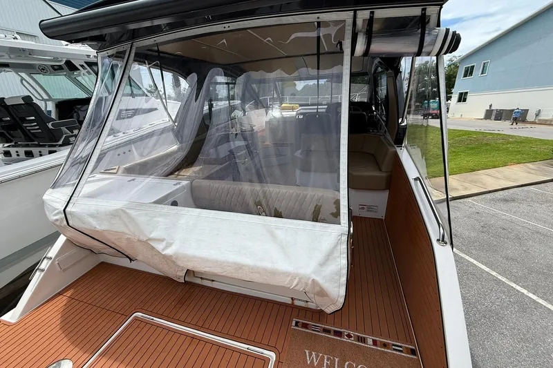 Slide: The Image of 2024 Hanover 387 boat with enclosed seating area and teak deck. - 5