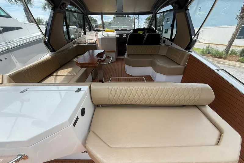 Slide: The Image of Luxurious interior of 2024 Hanover 387 boat with beige seating and wooden accents. - 7