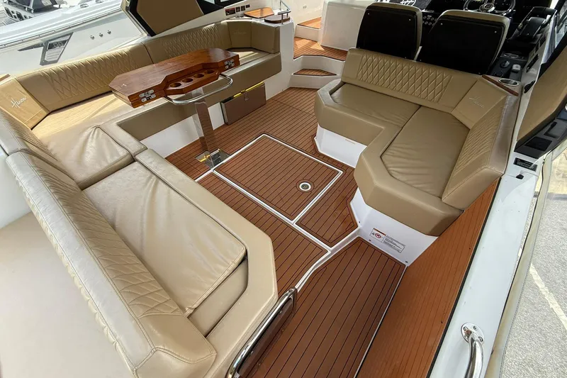 Slide: The Image of Luxurious seating area on 2024 Hanover 387 boat with elegant wood flooring. - 9