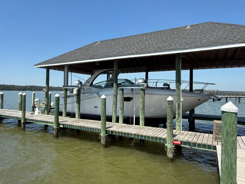 Slide: The Image of 2012 Sea Ray Sundancer 350 under covered dock. - 1