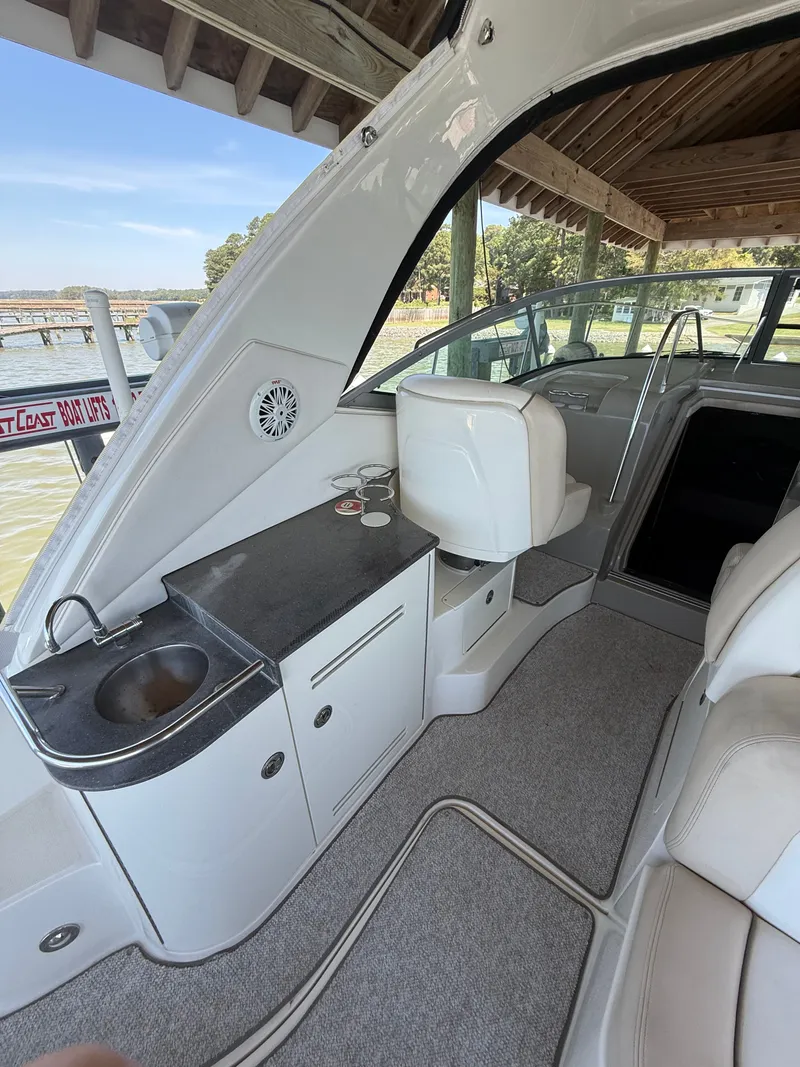 Slide: The Image of Interior of a 2012 Sea Ray Sundancer 350 yacht with sink and seating area. - 12