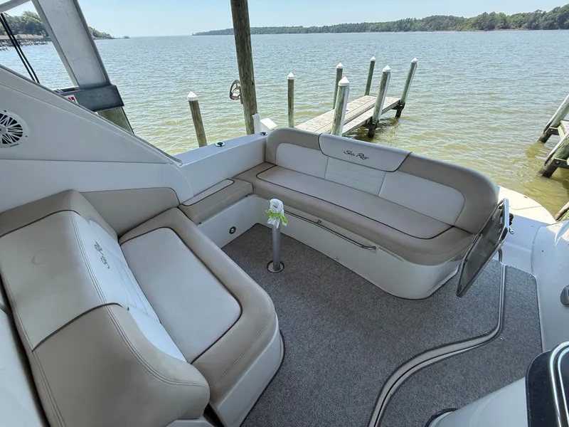 Slide: The Image of Interior of a 2012 Sea Ray Sundancer 350 yacht by the water. - 16