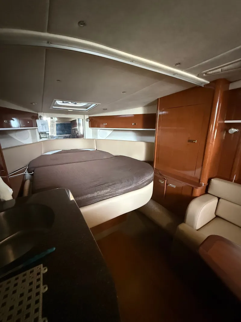 Slide: The Image of Interior of a 2012 Sea Ray Sundancer 350 yacht with sleeping area. - 19