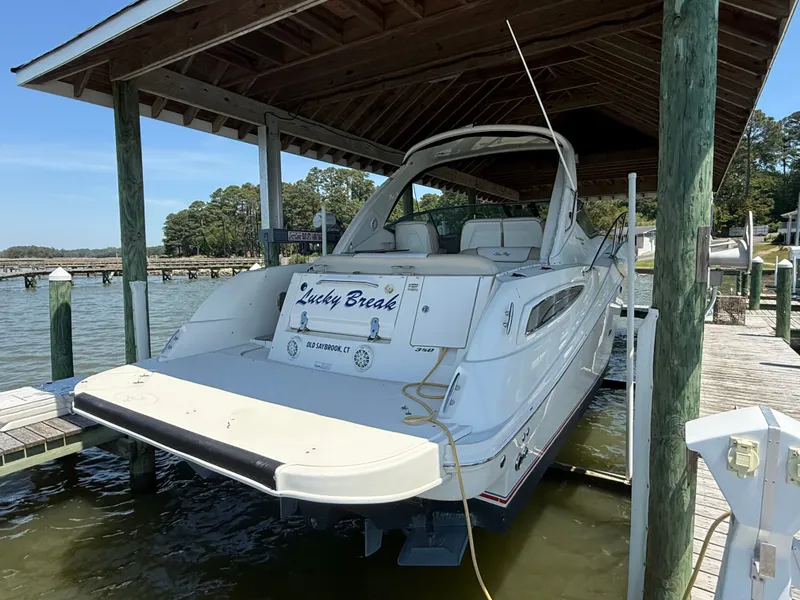 Slide: The Image of 2012 Sea Ray Sundancer 350 boat docked at marina. - 2