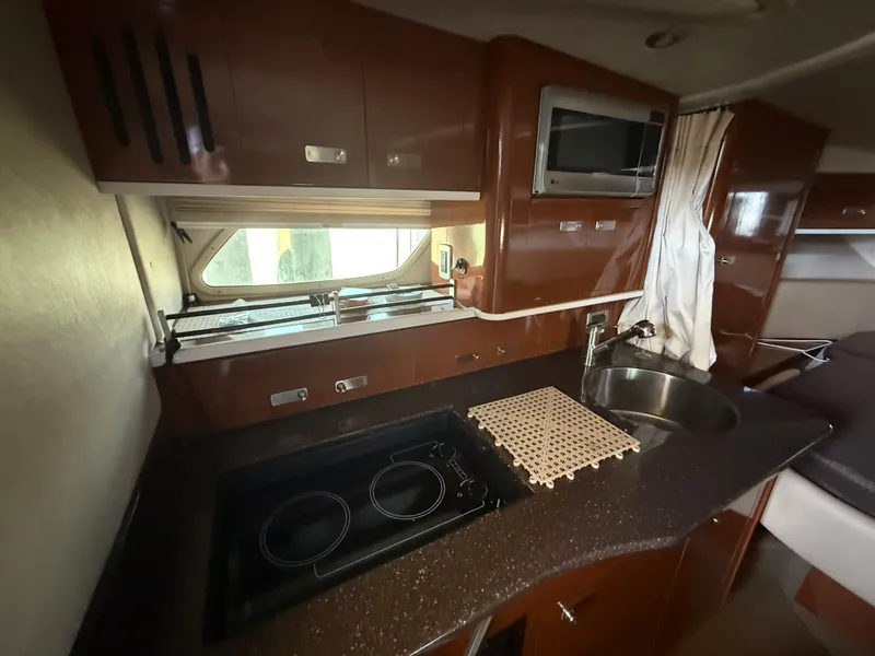 Slide: The Image of Interior of 2012 Sea Ray Sundancer 350 yacht kitchen. - 22