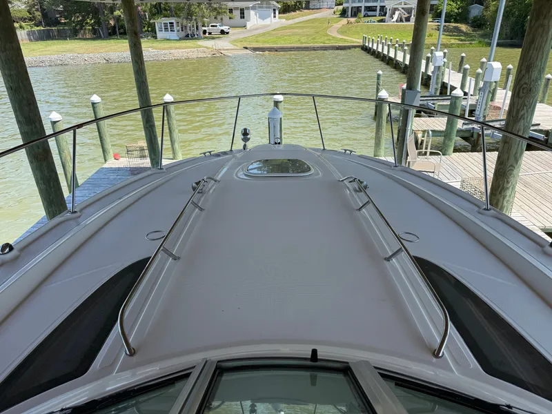 Slide: The Image of 2012 Sea Ray Sundancer 350 docked with waterfront view. - 32
