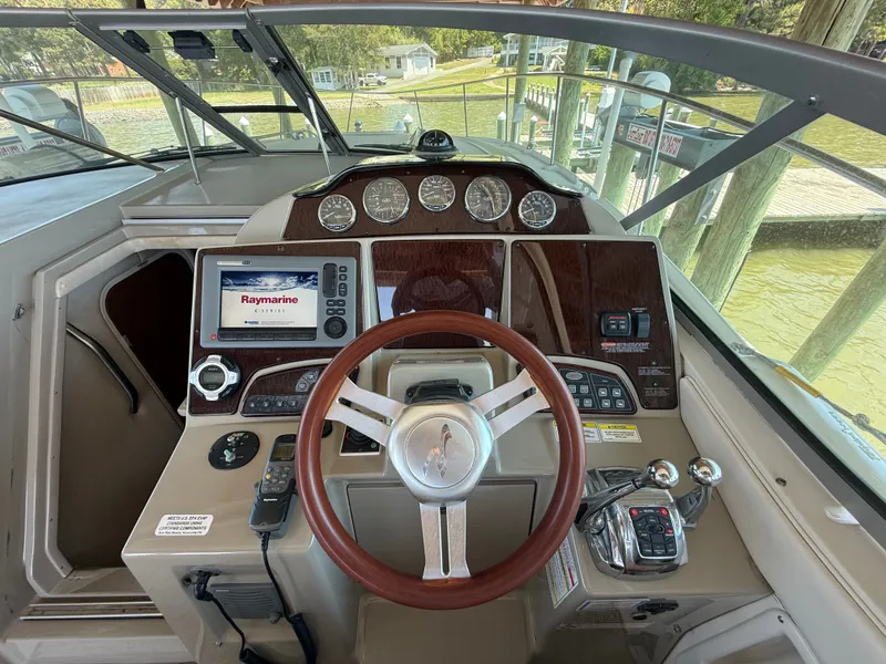 Slide: The Image of Sea Ray Sundancer 350 helm, 2012 model, featuring Raymarine navigation system. - 7