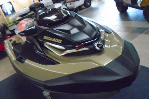 Slide: The Image of 2025 Sea-Doo RXT-X 325 jet ski displayed indoors, showcasing sleek design and branding. - 2