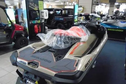 Slide: The Image of 2025 Sea-Doo RXT-X 325 jet ski displayed in showroom, wrapped in protective plastic. - 4