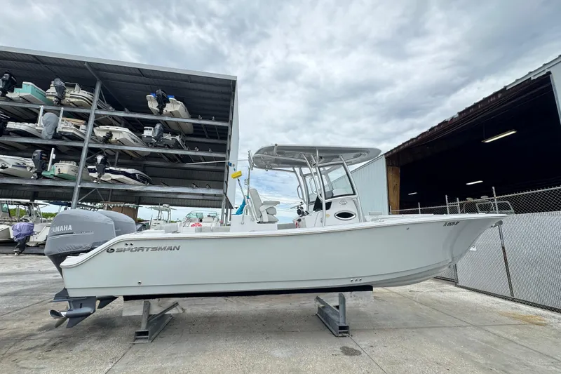 The Image of 2020 Sportsman Open 282TE Center Console boat on display at marina storage. - 0